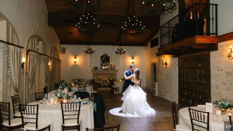 Couple dancing in the 9 Aviles ballroom in St. Augustine under a vaulted ceiling with iron chandeliers