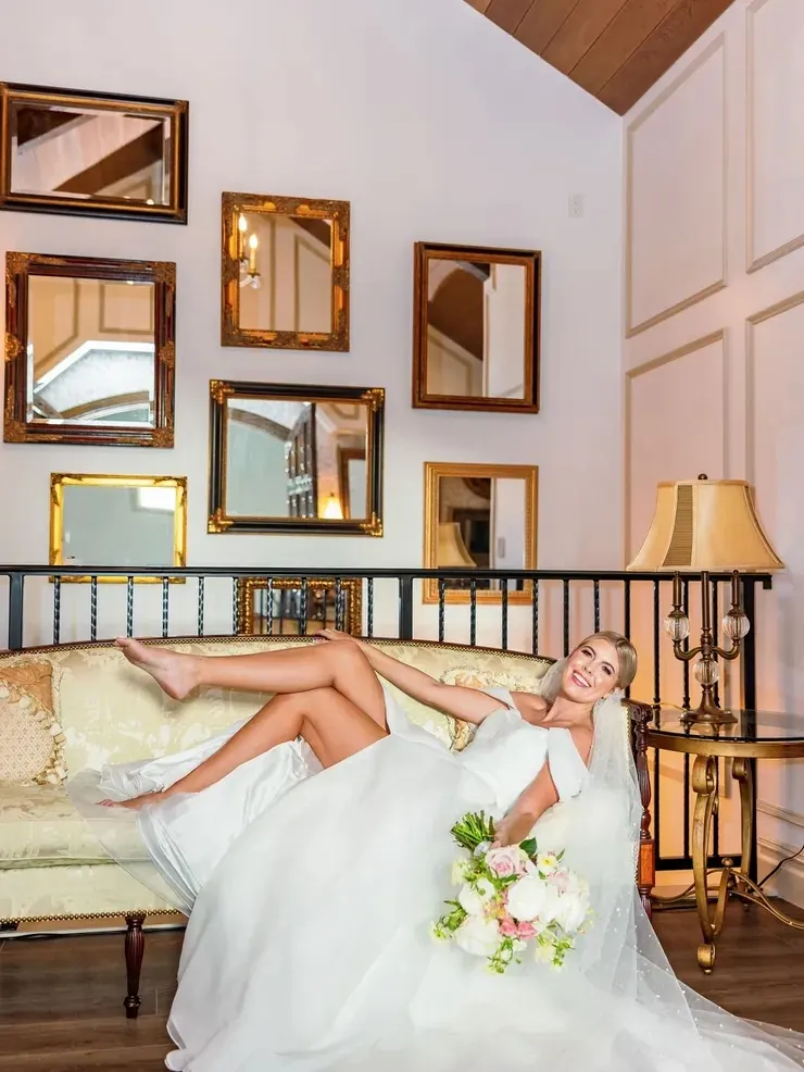 Bridal lounge with gilt mirrors and lamplight at 9 Aviles wedding venue in St. Augustine