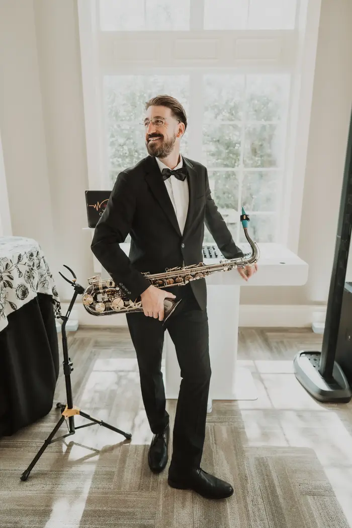 Corey Peterson playing live saxophone at a Jacksonville wedding reception