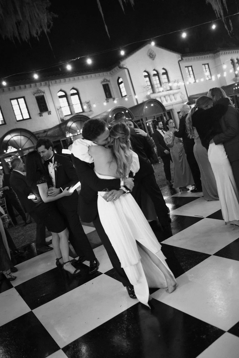 Couple dancing on checkered floor