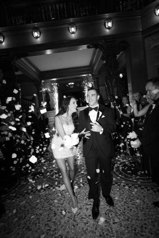 Black and white grand exit with cold sparks and petal toss at Flagler College Ponce de Leon Hotel St. Augustine