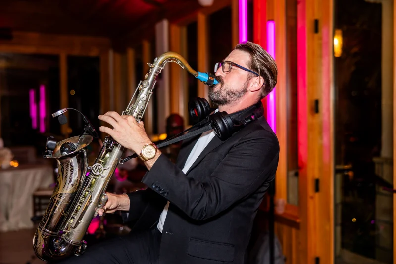 DJ playing live saxophone during reception at Fountain of Youth wedding