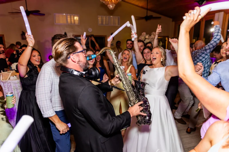 Live saxophonist performing on packed wedding dance floor at Fountain of Youth St. Augustine