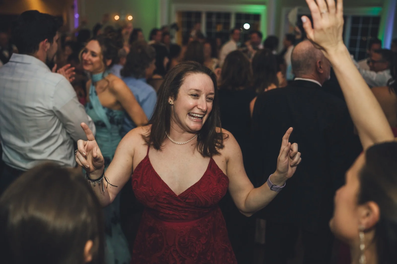 Packed dance floor with uplighting at River House
