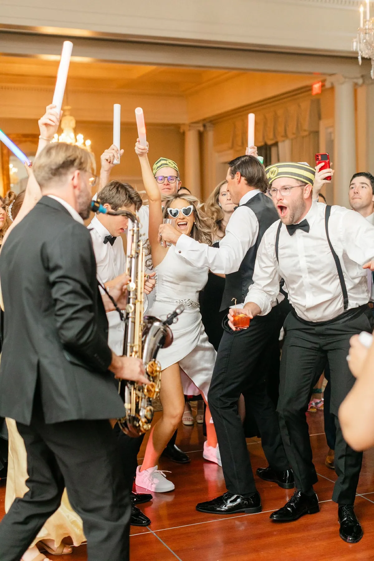 Wedding DJ and live saxophone on packed dance floor at Timuquana Country Club