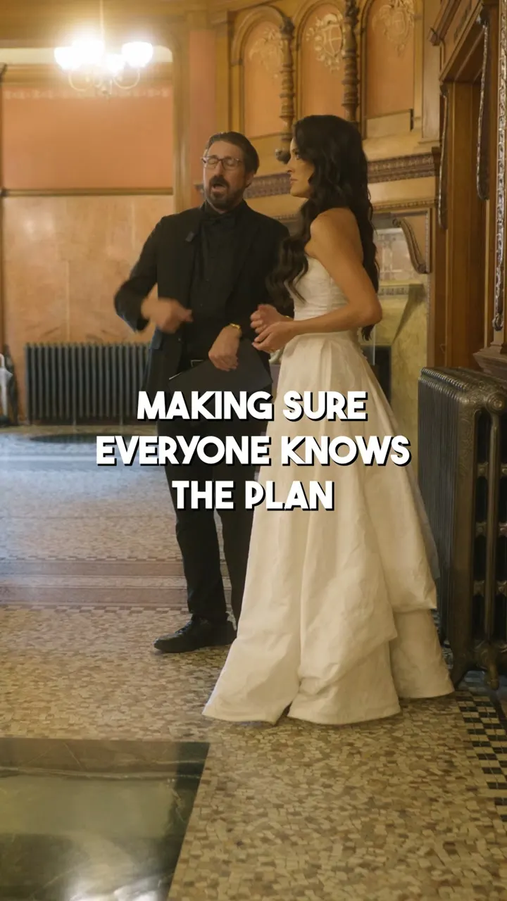 COS Celebrations founder Corey Peterson coordinating with the bride behind the scenes at a Flagler College wedding in St. Augustine